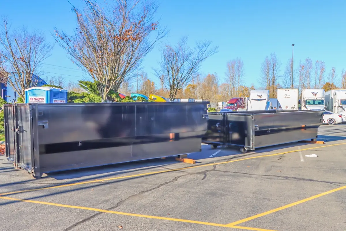 Professional dumpster rental service with roll-off container on residential driveway in Maurice River